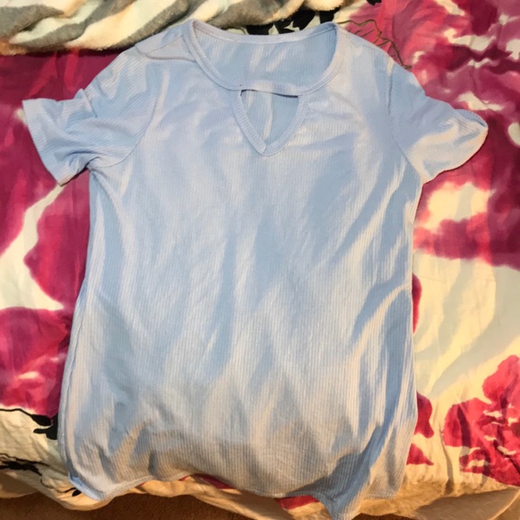 A blue XL kid shirt that I got from a boutique. - Picture 1 of 1